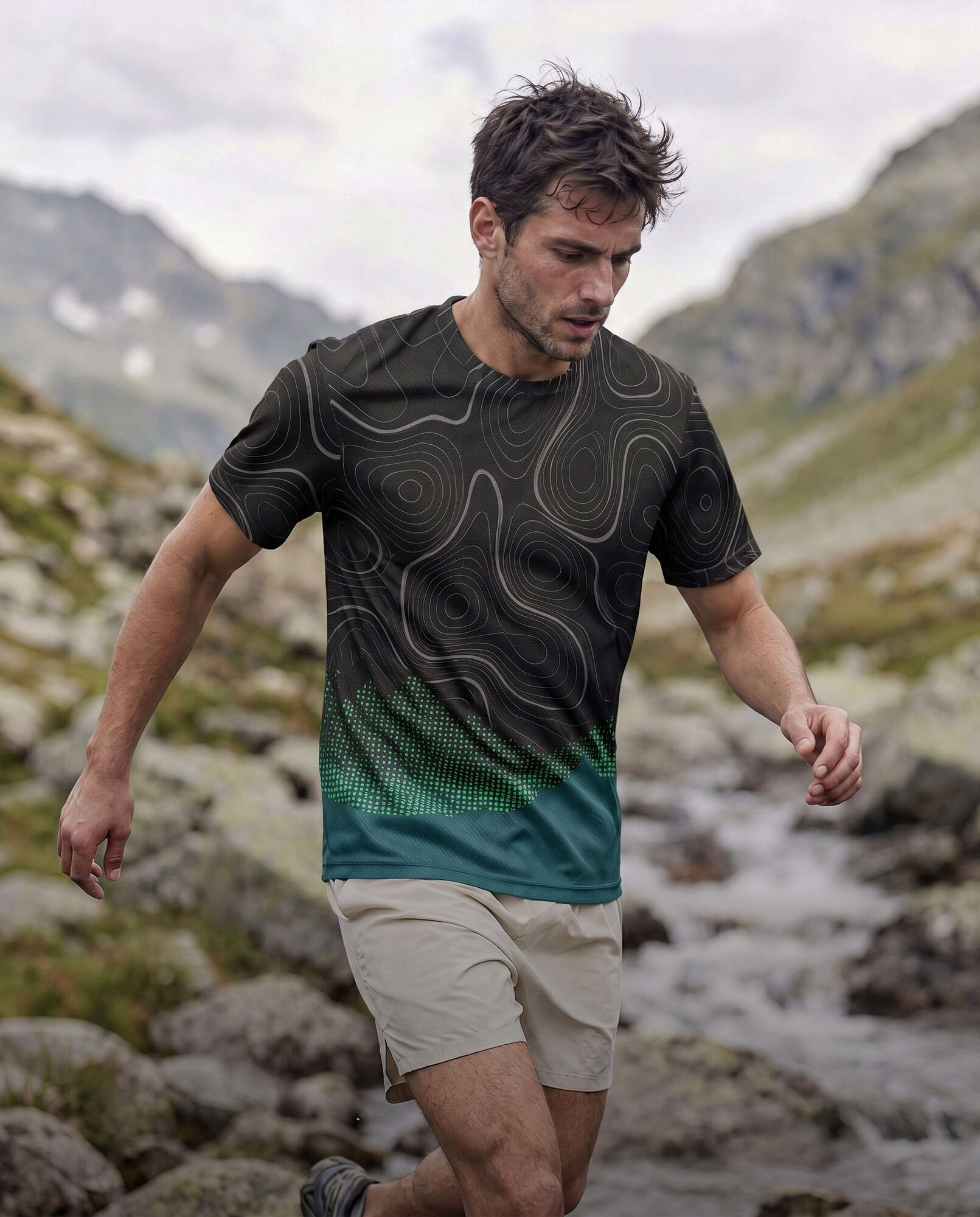 Art-directed AI photoshoot of a trail runner in a topo print running tee crossing an alpine stream under overcast light