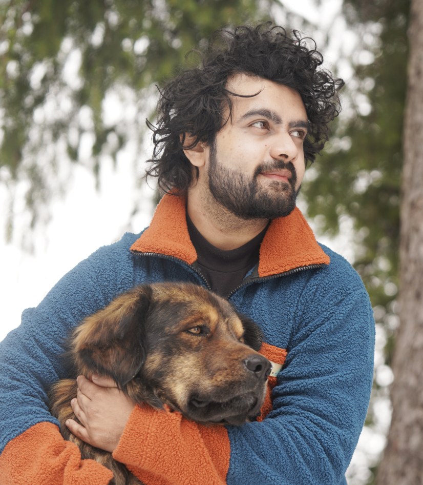 Rahul Mistry with his dog in the snow